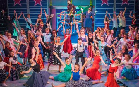 Cast of Grease posing at the finale